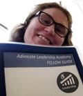 NM LEND Self-Advocacy fellow Laurel Deans with binder from Advocate Leadership Academy